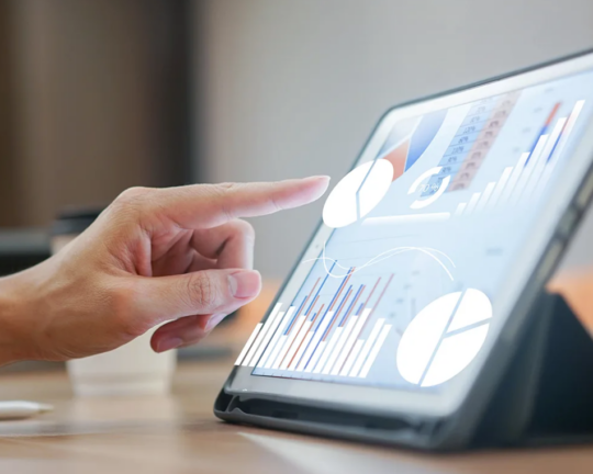 person looking up financial planning information on tablet